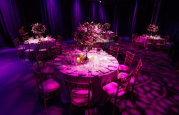 dinner set up, conference venue, centrepieces, dark lighting