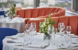 focussed centre table, white covered table, wine glasses, exclusive venue hire