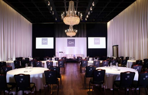 grand hall, projector screens, conference room, cabaret layout, chandelier