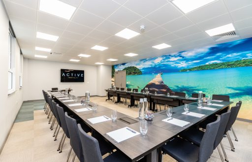 meeting room, beach feature wall, TV screen, inspiring meeting space