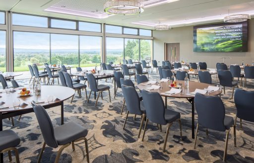 conference room, view of the outside, large TV screen, natural daylight, modern