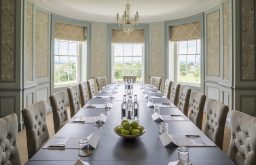 boardroom, meeting room, natural daylight, view of the outside, water bottles