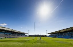 rugby field, stadium, bright blue sky