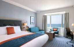 hotel suite, sea view, bed