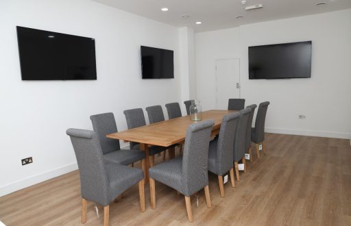 meeting room, plasma screens, boardroom layout, grey comfortable chairs