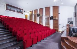 auditorium, conference room, red chairs, stage