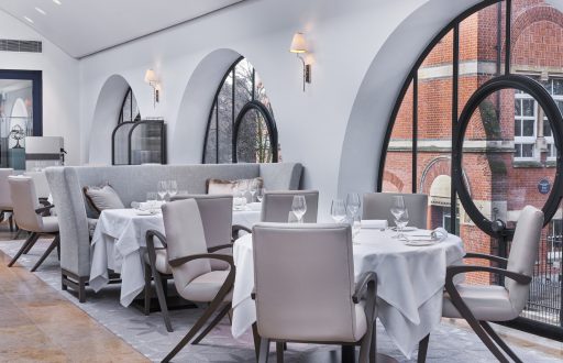 luxury modern restuarant, white and grey furnishings, semi circle windows