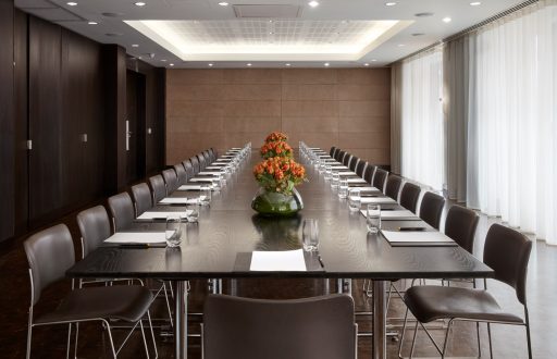 boardroom, natural daylight, flower centerpieces, modern meeting room