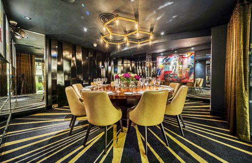 mirrored private dining room, centred round table, wine glasses, luxury, comfortable chairs