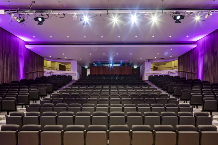 purple lighting, auditorium, AV area at the back of the room