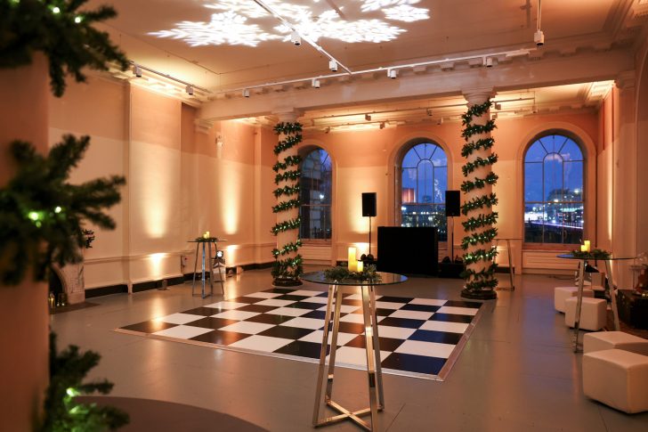 Christmas event space, snowflake light beamer on the celing, festively decorated, drinks reception