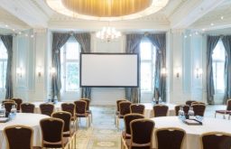 conference room, projector screen, modern, cabaret style, natural daylight