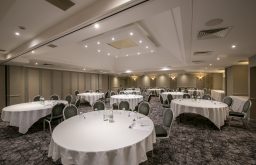 cabaret layout, conference room, water and glasses on the table