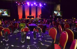 event space, cabaret layout, two plasma screens besides the stage, fine dining